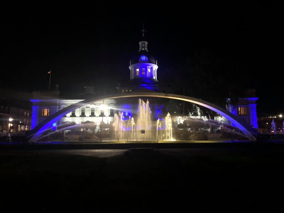 City Hall in KIngston illuminated blue and white for dystonia.